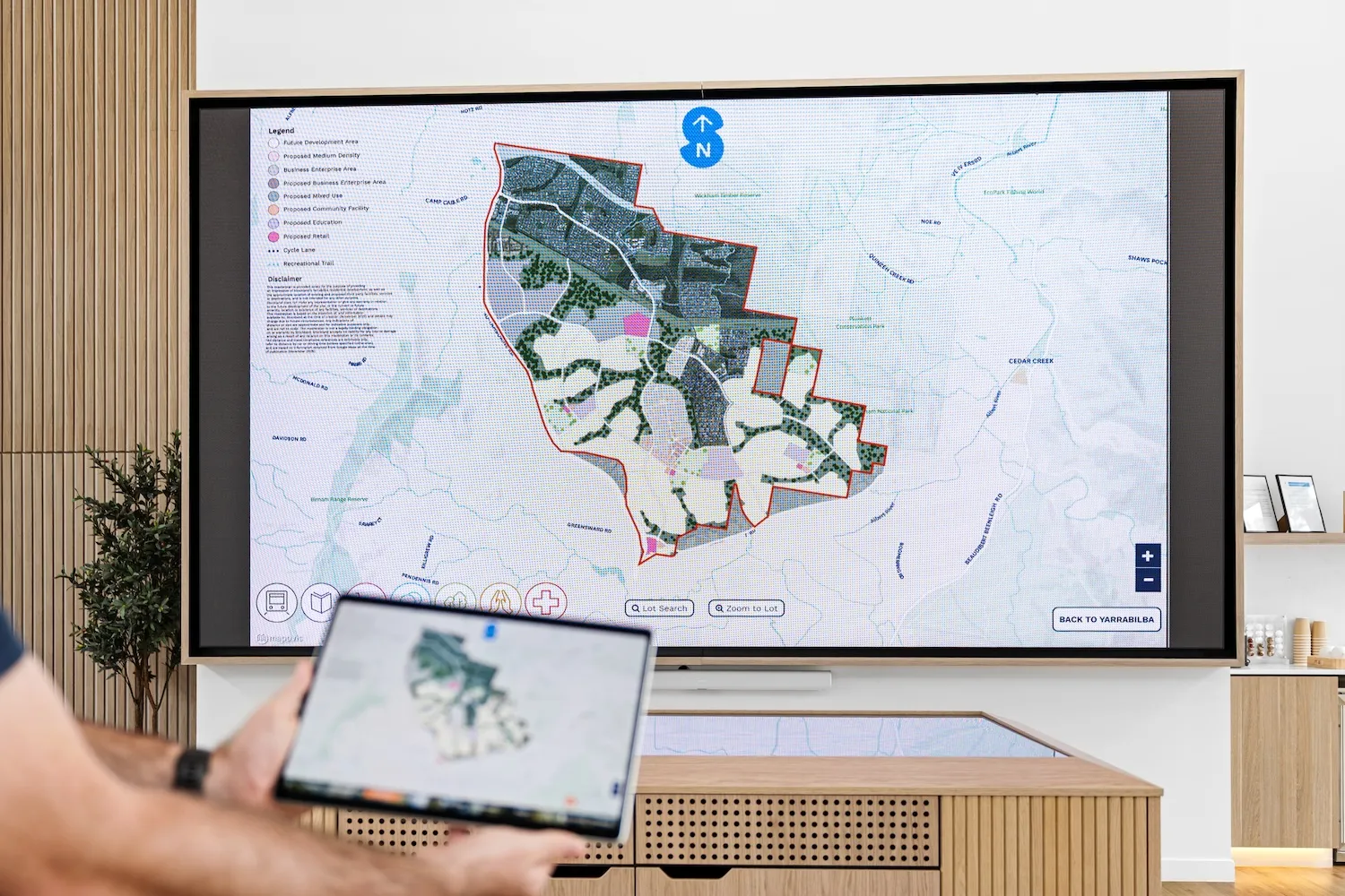 Interactive masterplan on a touch table in a land sales display suite